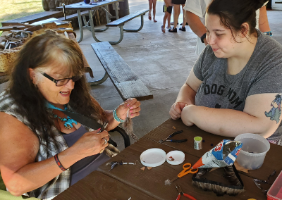 making Native style earrings with dentalia shell and feathers