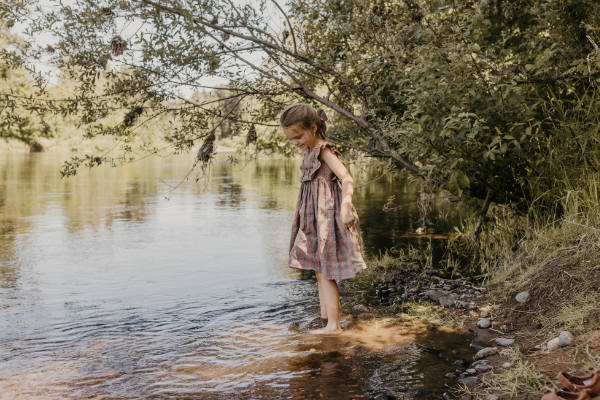 girl in river at Waterloo encampment 